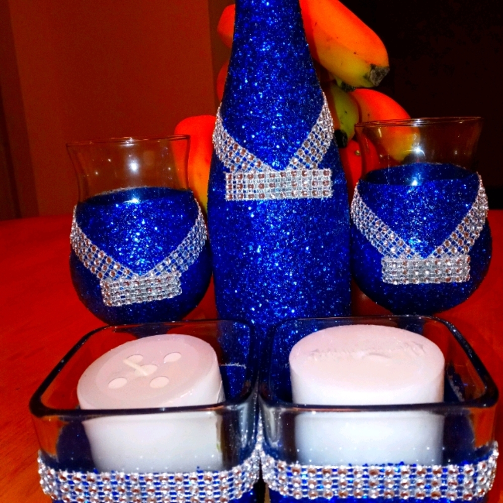 Wine bottle...2 wine glasses and 2 candle holders